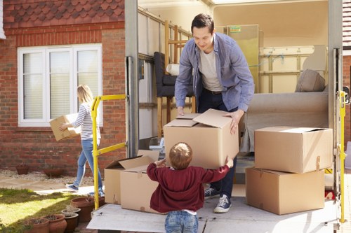 Professional movers navigating a narrow South Kensington street with a removal van