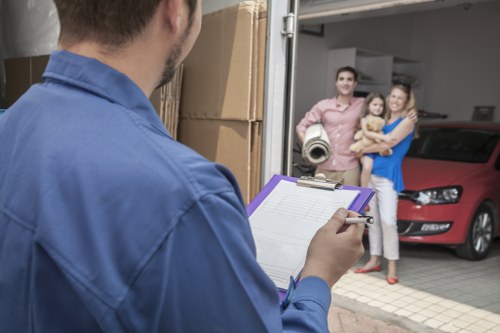 Movers protecting large furniture during transport