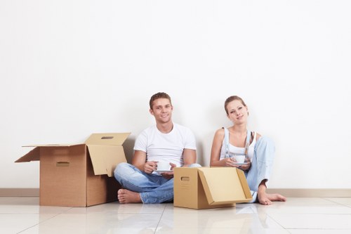 Local moving team handling boxes in a South Kensington street with access considerations