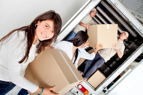 Careful loading of belongings into a van for a South Kensington move