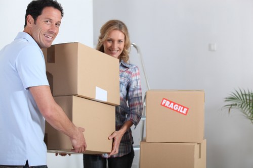 Careful handling of boxed belongings during an urgent local relocation